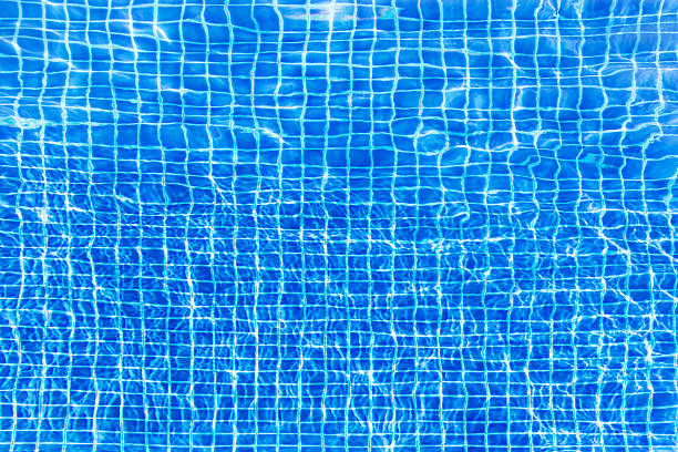 istock Water surface turquoise swimming pool background 626777198