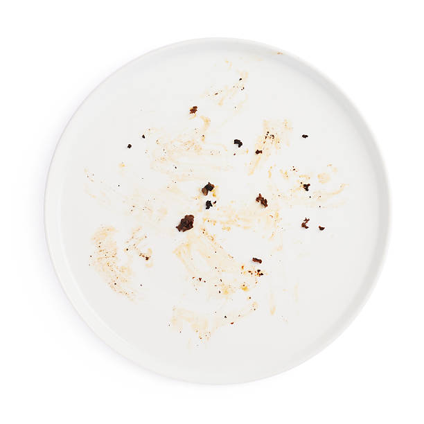 istock Dirty big plate over white isolated background 626777378