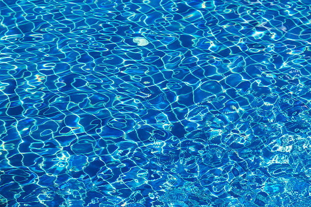 istock Water surface turquoise swimming pool background 626777406