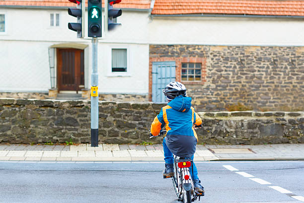 istock Little preschool kid boy riding on bicycle 626778366