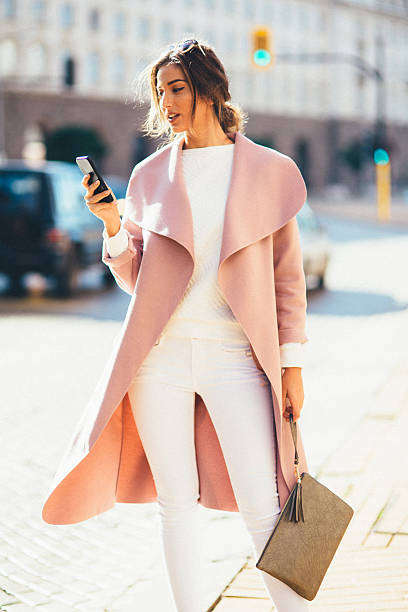 istock Beautiful woman texting on the phone 626778426