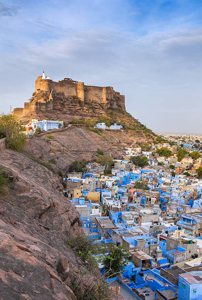 Blue city and Mehrangarh fort on the hill at night stock photo