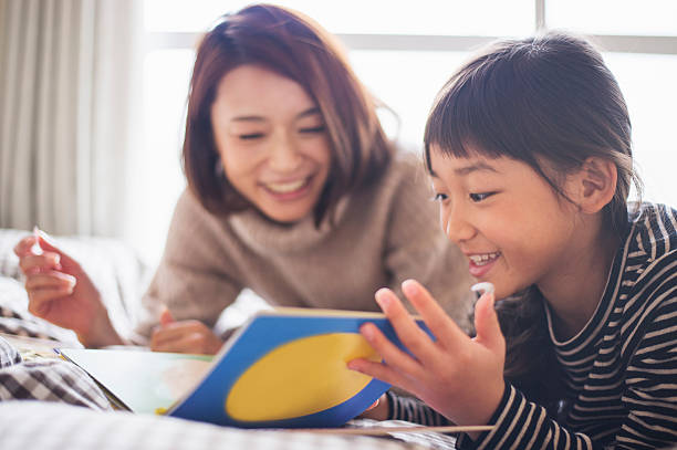 istock Mother and daughter playing in bedroom 626780026
