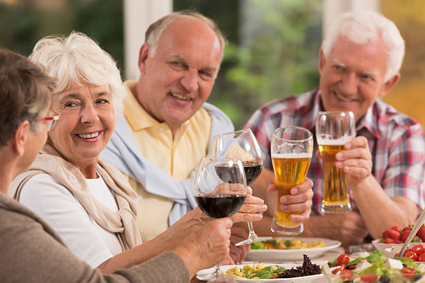 istock Happy elderly friends drinking beer 626781482