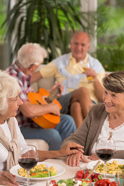 istock Two senior women drinking wine 626781574