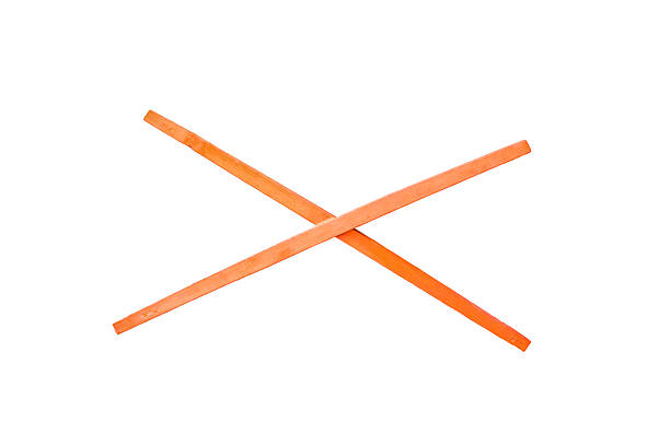 istock Old Red wooden post with a cross on white background 626782424