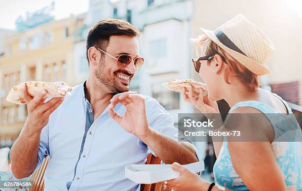 Loving Couple Eating Pizza Outdoors Stock Photo - Download Image Now - Italy, Eating, Pizza