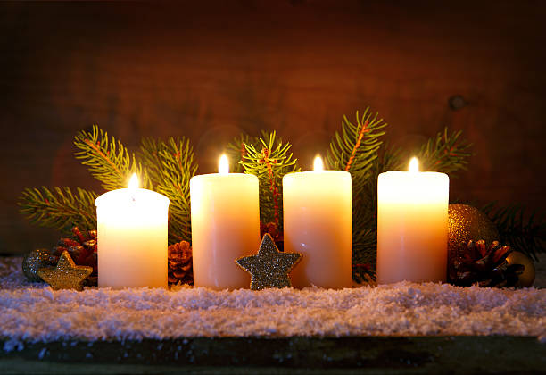 istock Four burning advent candles and Christmas decoration. 626785280