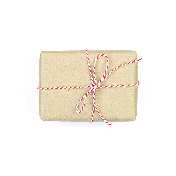 istock Gift box wrapped in recycled paper isolated on white background 626787014