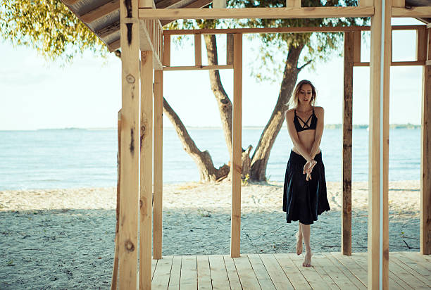 istock Young beautiful girl dancing on the beach. Summer. Dynamic. Cont 626788674