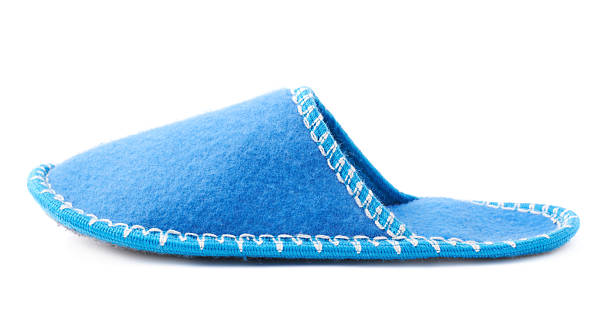 istock Single house slipper isolated over white background 626789346