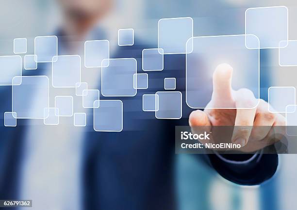 Abstract Business Concept Businessman Touching Button On A Virtual Interface Stock Photo - Download Image Now