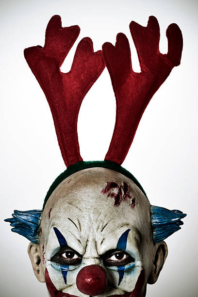istock scary evil clown with reindeer antlers headband 626798902