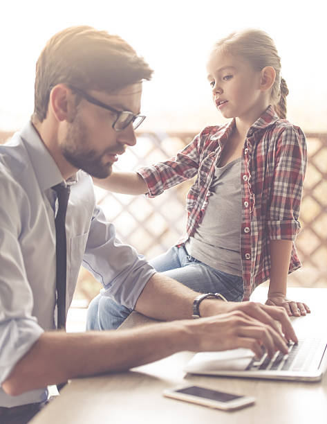 istock Handsome businessman and his daughter 626800352