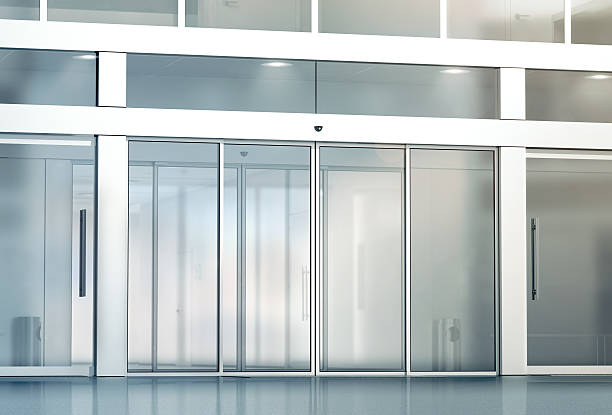 Blank sliding glass doors entrance mockup Blank sliding glass doors entrance mockup, 3d rendering. Commercial automatic entry mock up. Office building exterior template. Closed transparent business centre facade, front view. automatic stock pictures, royalty-free photos & images