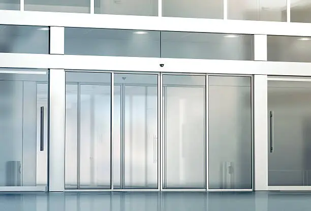 Blank sliding glass doors entrance mockup, 3d rendering. Commercial automatic entry mock up. Office building exterior template. Closed transparent business centre facade, front view.