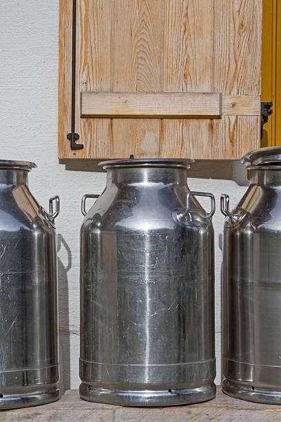 istock Milk cans in front of the mountain hut 626806220