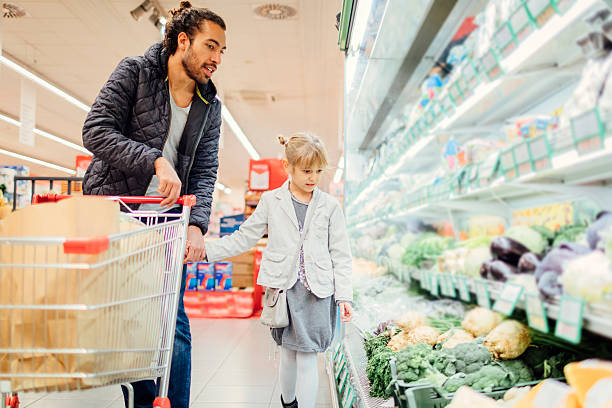 istock Father And His Daughter In A Supermarket. 626806536