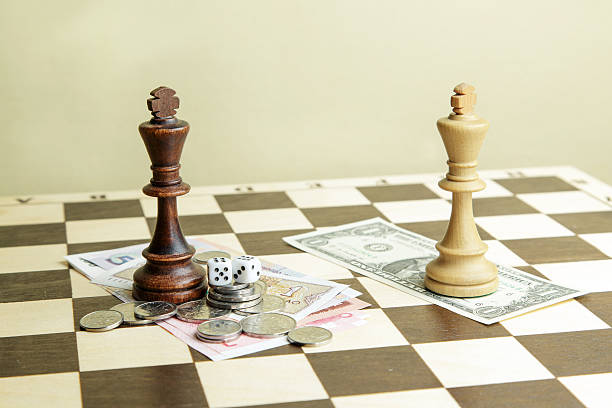 istock Dice, money and chess kings on a board 626808500