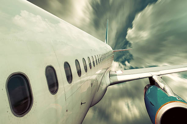 istock Airplane at fly on the sky with clouds 626810320