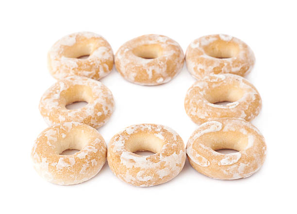 istock Pile of small cakes with hole isolated over the white 626810488