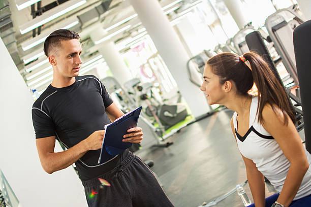 istock Personal trainer explaining exercise results to his female client. 626811240