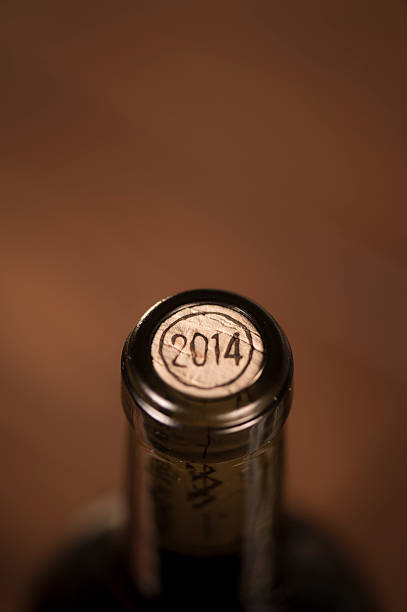istock Close-up of closed wine bottles lying on blurry background 626811264