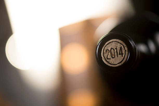 istock Close-up of closed wine bottles lying on blurry background 626811818