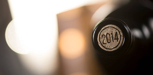 Close-up of closed wine bottles lying on blurry background