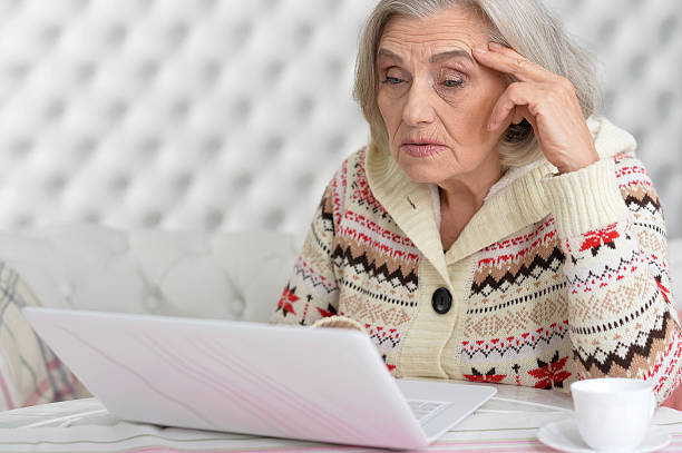 istock Senior woman with laptop 626812454