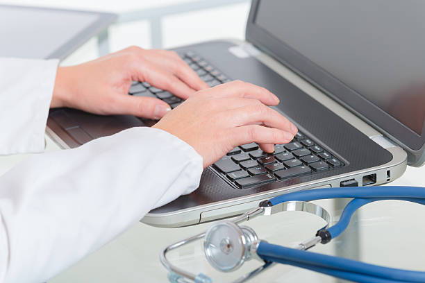istock Medical doctor typing on laptop 626814760