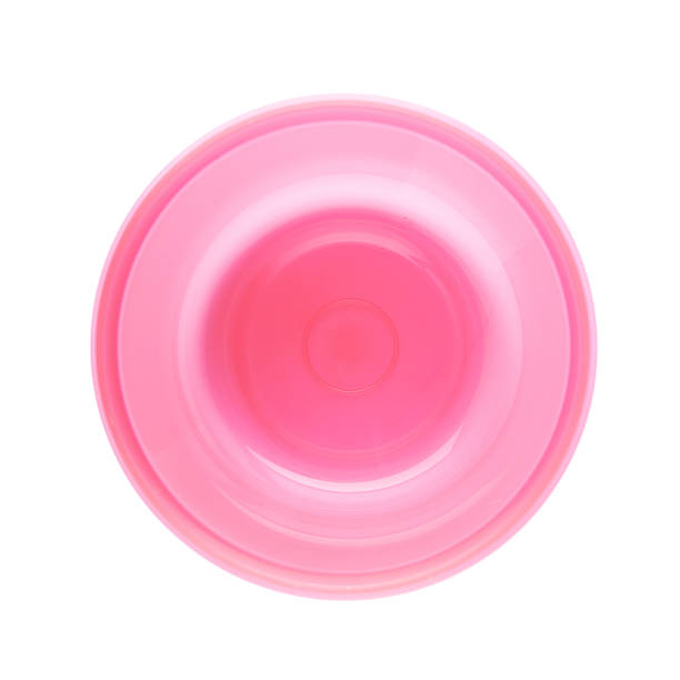 istock Pink plastic beaker cup isolated over the white background 626814796