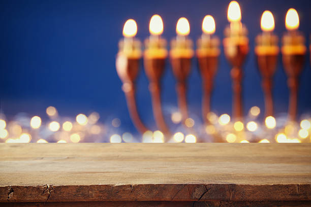 istock Empty table in front of jewish holiday Hanukkah background 626816760