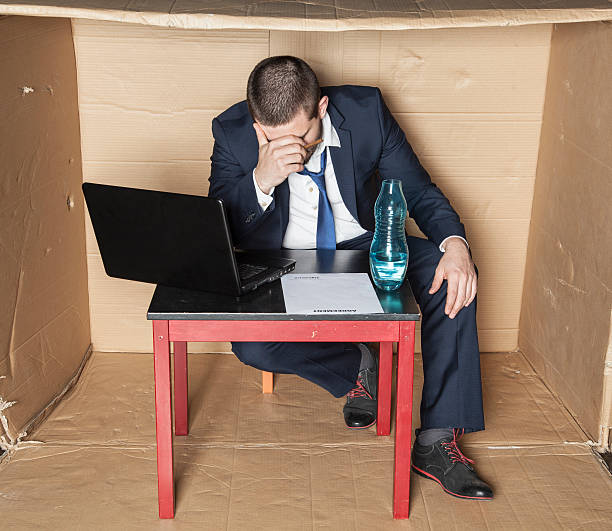 istock businessman broke and drunk 626823240