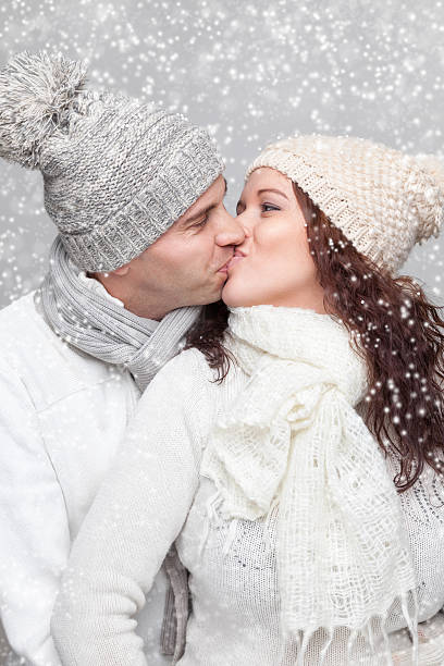 Young happy couple dressed in warm clothes in winter