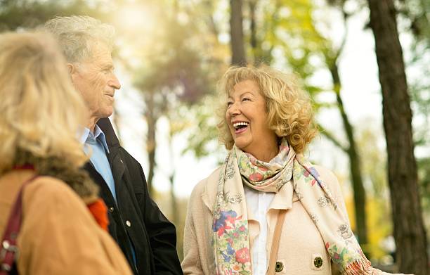 istock Three smiling seniors enjoying at park. 626823568