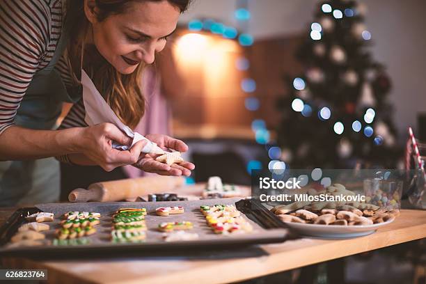 Making Gingerbread Cookies For Christmas Stock Photo - Download Image Now - Christmas, Cookie, Baking