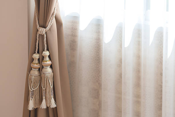 istock beautiful curtain tie by curtain strap with sunlight 626824262