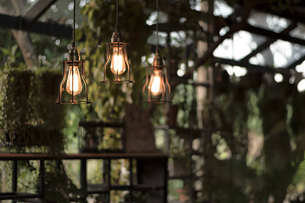 istock beautiful Light bulb incandescent hanging decorated interior roo 626824308