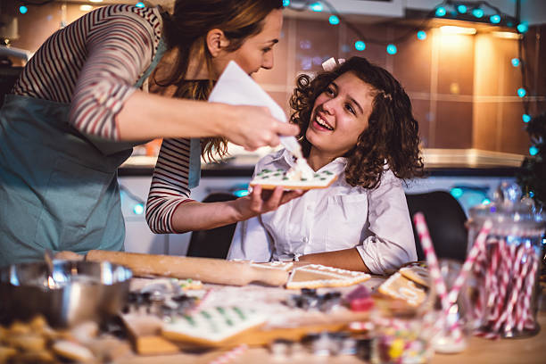 istock Mother and daughter making Gingerbread cookies for Christmas 626824420