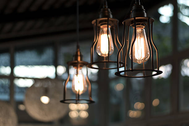 istock beautiful Light bulb incandescent hanging decorated interior roo 626824500