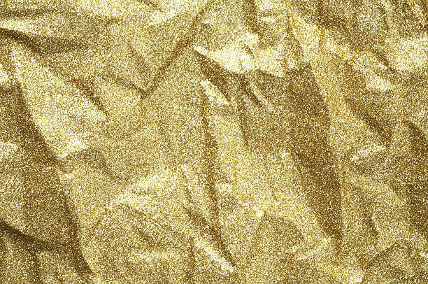 istock Gold wrinkled paper texture abstract background 626826438
