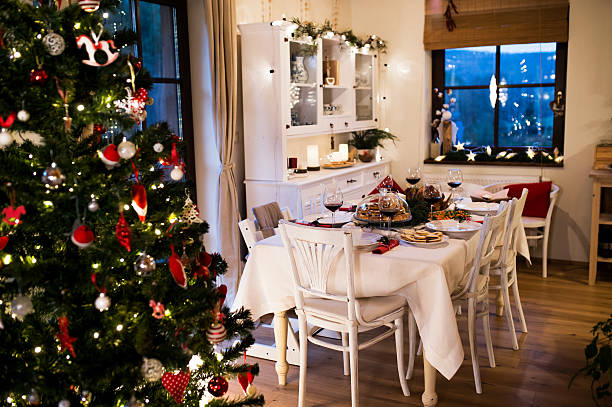 istock Christmas meal laid on table in decorated dining room. 626830492