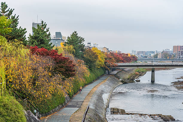 istock Public walkway beside river for relaxing when autumn. 626830686