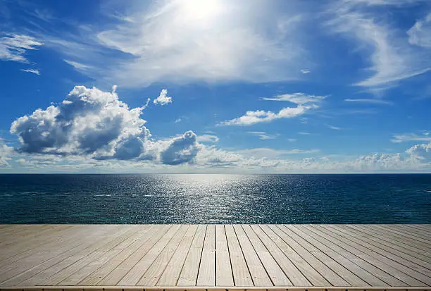 Photo of Wooden terrace beside tropical sea