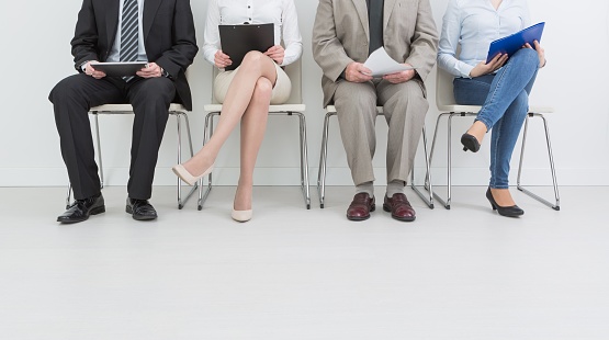 hire employment employ interview candidate hiring legs business waiting cv women sitting queue group employer elegant executive caucasian female male indoors men colleague room concept - stock image