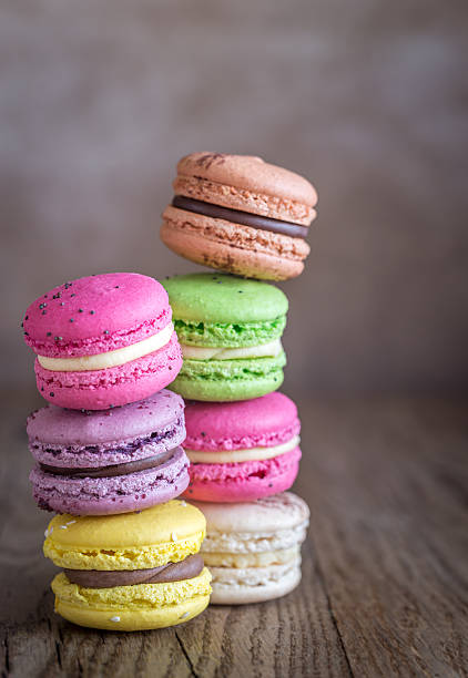 istock Colorful macarons on the wooden background 626838150