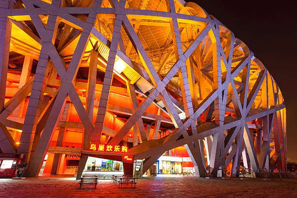Beijing National Stadium Beijing, China - October 25, 2016: A close-up wide-angle night view of side of Beijing National Stadium, also known as Bird's Nest, at Olympic Park in Chaoyang District. beijing olympic stadium photos stock pictures, royalty-free photos & images