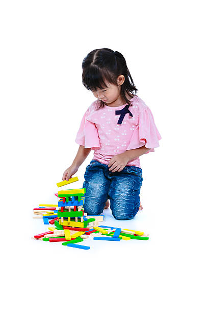 istock Child playing toy wood blocks, isolated on white background. 626839848