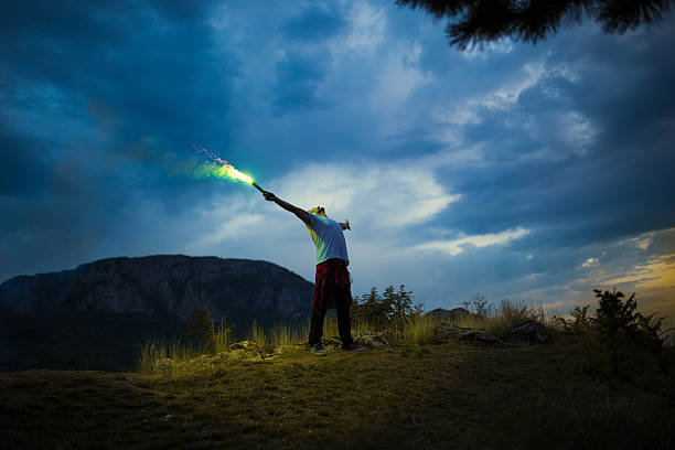 istock Man with flaming torch outdoors 626839992